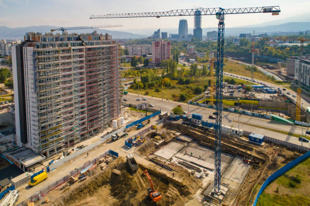 istock Industrial construction cranes and construction in Sofia, Bulgaria. Aerial view of construction site and construction machinery. Drone point of view 1362531703