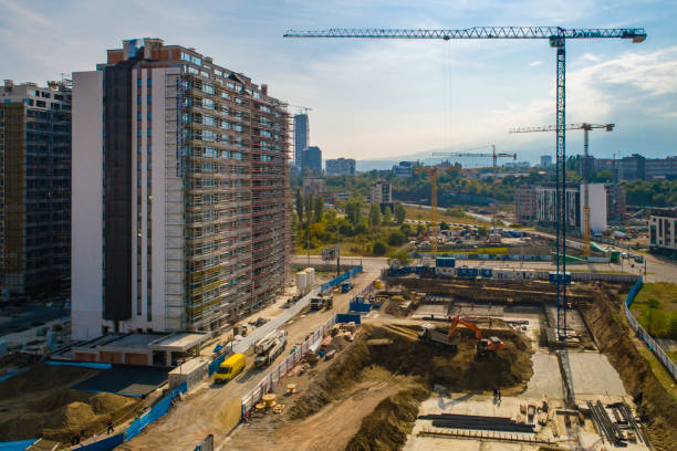 istock Industrial construction cranes and construction in Sofia, Bulgaria. Aerial view of construction site and construction machinery. Drone point of view 1362531776