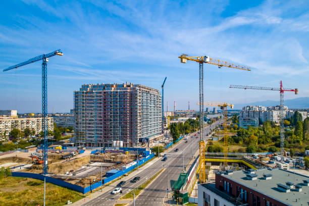 istock Industrial construction cranes and construction in Sofia, Bulgaria. Aerial view of construction site and construction machinery. Drone point of view 1362531797