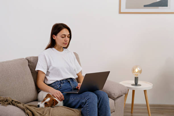 istock Young brunette woman with small breed dog. 1362532884