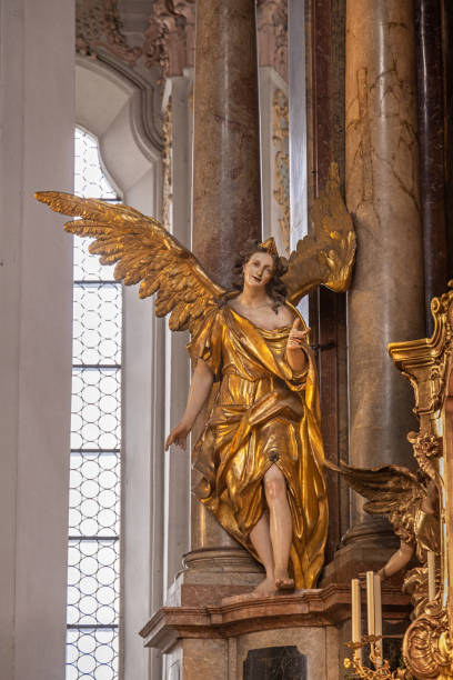 Gold plated angel in the Heilig-Geist-Kirche, Church of the Holy Spirit which is standing in the center of the German city Munich is one of the oldest churches in Munich but was remodeled in 1730 and 1885. Today it is partly a reconstruction made after second world war.