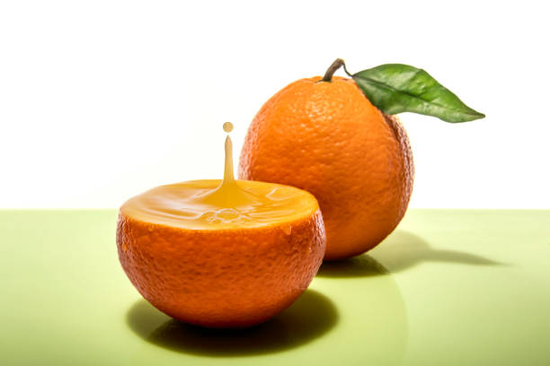 istock Splash of delicious orange juice on an orange 1362533021