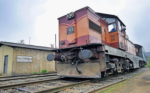 Diesel train engine and carriages pass through the highest railway station in Sri Lanka at Pattipola in the Ambewela Mountains, Sri Lanka, South Asia. Sri Lanka, formerly Ceylon, is a  beautiful warm tropical island off the south eastern coast of India with a rich history of Sinhalese kingdoms and a mixture of faiths including Hindu Buddhist and Tamil as well as Dutch and British colonial influences. It has a wealth of birdlife and wildlife including many endangered wild animals.