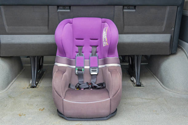 Child Safety Seat With Restraint System Belts in Van Booth