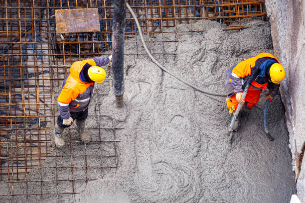 Workers pouring concrete stock photo