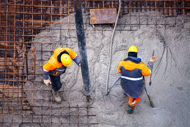 Workers pouring concrete stock photo