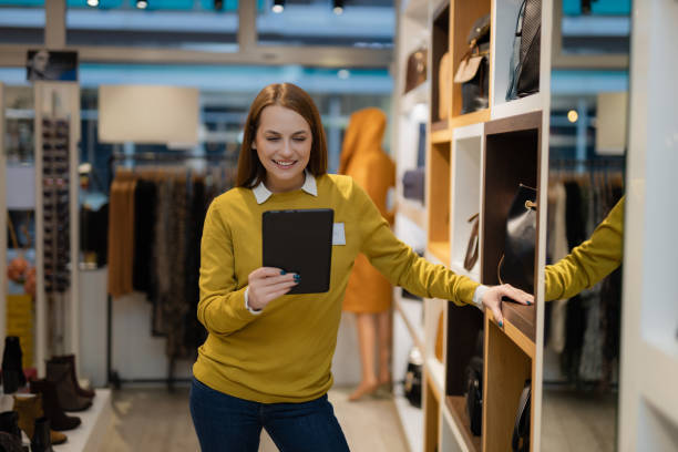 istock Woman working in the clothing store and using a digital tablet 1362538956