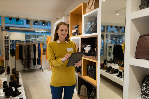 istock Clothing a shoe store manager using a digital tablet 1362540063