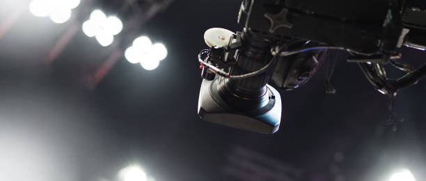 istock TV Camera broadcast on the crane tripod for shooting or recording and broadcasting content in studio production to on air tv or online internet live show. HD Video recording on crane. Selective focus. 1362540359