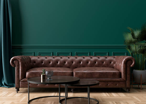 istock Empty green wall in modern living room. Mock up interior in classic style. Free space, copy space for your picture, text, or another design. Brown leather sofa, plant, parquet floor. 3D rendering. 1362542692