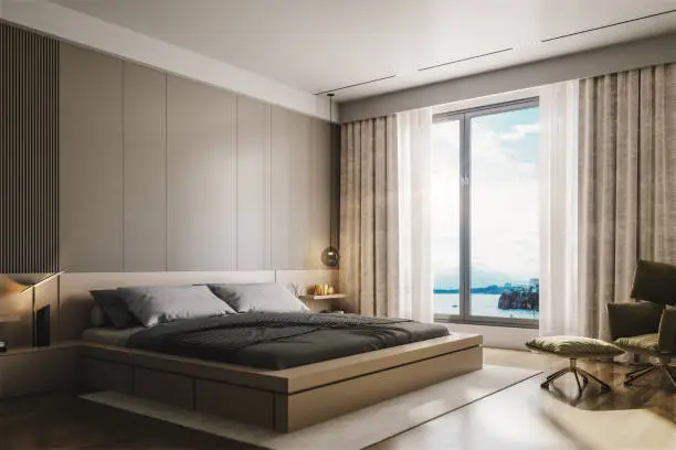 Interior of a modern luxurious beige bedroom.