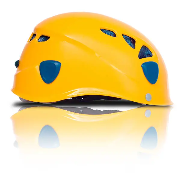 Photo of right side view of orange climbing helmet