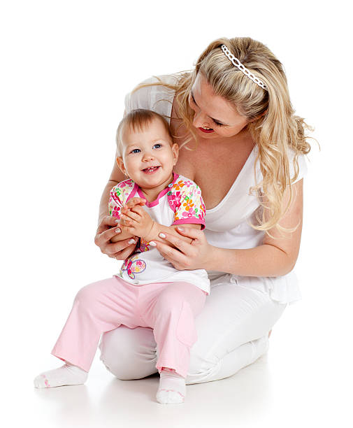 istock Child sitting on loving mother's knees 136254438