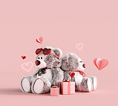 Teddy bear couple with gifts and hearts on pink background