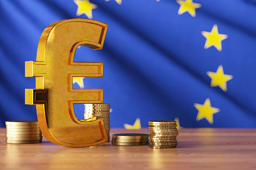 Golden Euro Sign with EU Flag and Coins. 3D Render