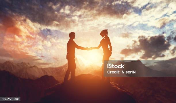 Alien And Man Meet And Handshake On Planet Stock Photo - Download Image Now - Alien, UFO, Artificial Intelligence