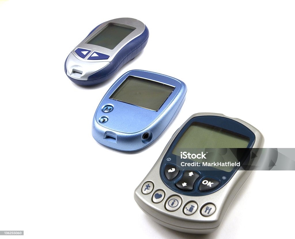 Três Glucometers de diferentes fabricantes - Foto de stock de Açúcar royalty-free