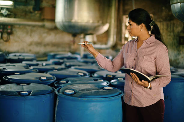 istock Woman taking note of logistics in a warehouse 1362553770