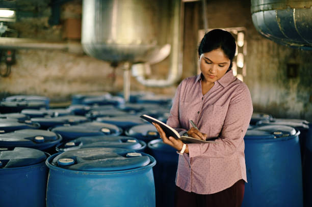 istock Woman taking note of logistics in a warehouse 1362553773