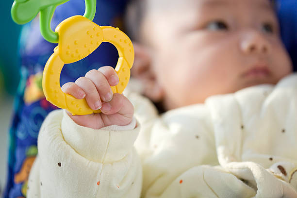 istock Baby playing with toy. 136255407