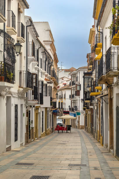 Street in Ronda, Spain Street with historical building in Ronda city center, Spain narrow streets stock pictures, royalty-free photos & images