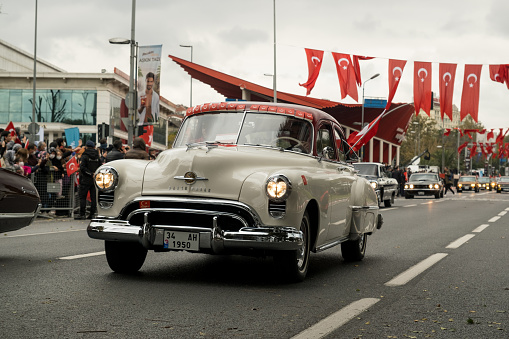 Istanbul, Turkey - October 29, 2021: A white 1950 Oldsmobile rocket 88 parade on October 29 republic day of Turkey, Classic car parade moment.