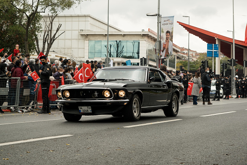 Istanbul, Turkey - October 29, 2021: Front view of a black 1965 Ford Mustang GT 350 classic car on October 29 republic day of Turkey, Classic car parade moment.