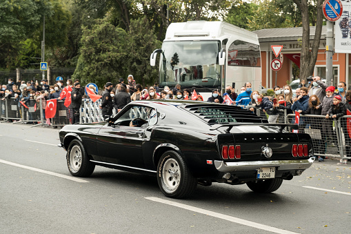 Istanbul, Turkey - October 29, 2021: Rear view of a black 1965 Ford Mustang GT 350 on October 29 republic day of Turkey, Classic car parade moment.