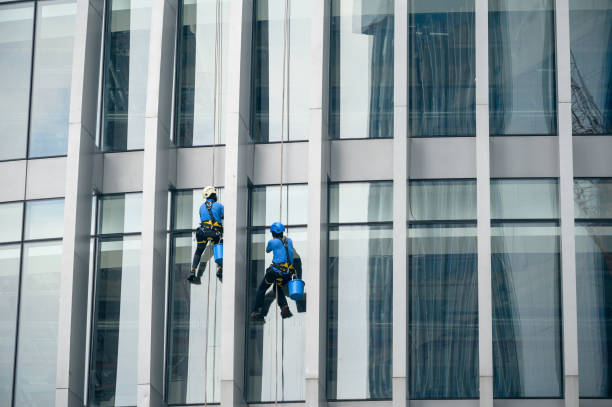 istock Window cleaners is working on the high rises office building facade 1362555620