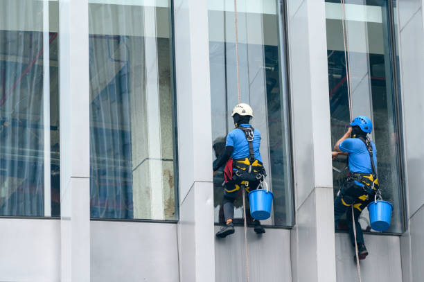 istock Window cleaners is working on the high rises office building facade 1362555625