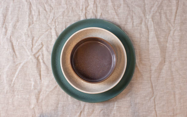 istock Colored circle shaped ceramic plate on isolated background, food mockup 1362558570