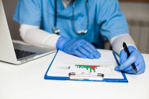 istock Medical doctor studying Coronavirus infection and deaths chart 1362559573