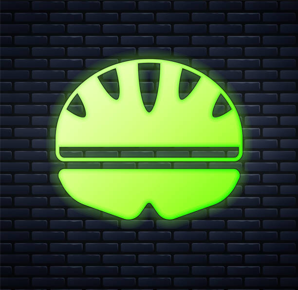 świecąca neon ikona kasku rowerowego izolowana na tle ceglanej ściany. sport ekstremalny. sprzęt sportowy. wektor - bicycle wall green single object stock illustrations