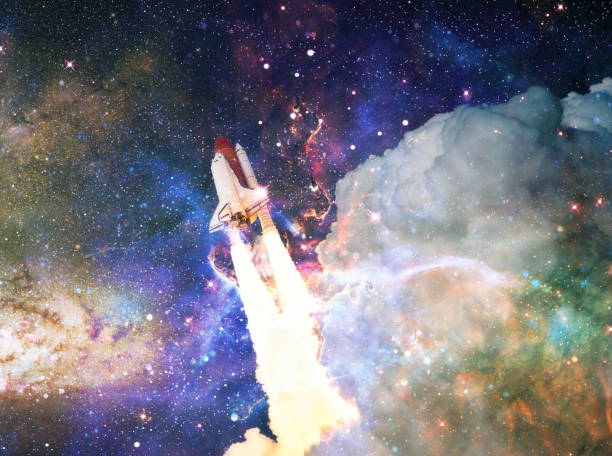 istock Rockets launch into space on the starry sky. spacecraft flies into space with clouds of smoke. Elements of this image furnished by NASA 1362564430