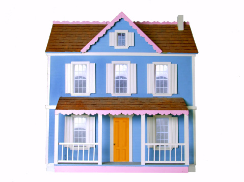 a pink and blue dollhouse on a white background