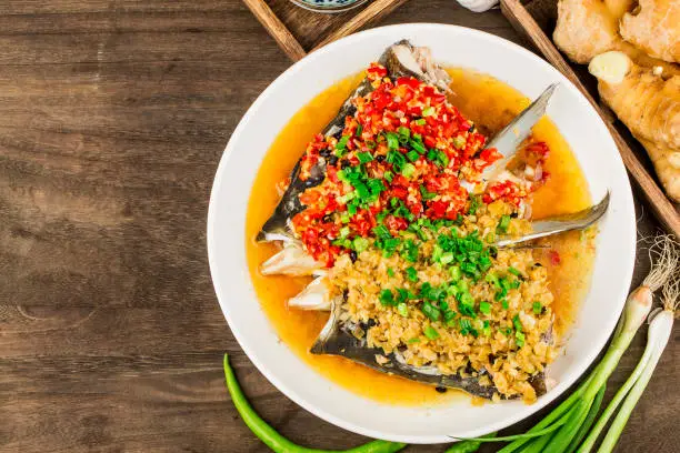 Steamed fish head with diced hot red peppers