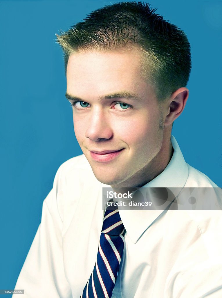 Young man with blue eyes a young man with a knowing look, dressed for business Adult Stock Photo