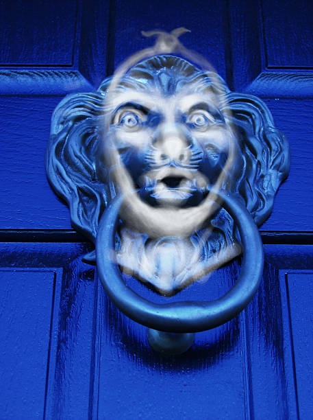 Scroooooge! The ghost of Jacob Marley appears in the lion's head door knocker. charles dickens stock pictures, royalty-free photos & images