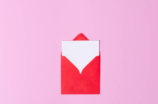 istock Red envelope with greeting card mockup on purple pastel pink copy space background. St Valentine, Mother's Day concept. 1362565084