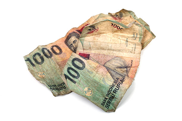 istock Two dirty Indonesian banknotes isolated on white. 136256850