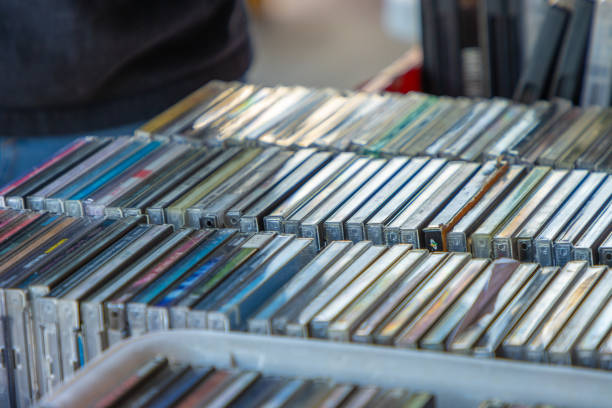 Music CD collection A stack of old music CDs on display outside a store. compact disc stock pictures, royalty-free photos & images