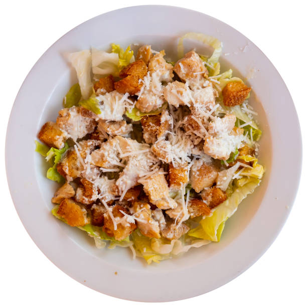 istock Cesar salad with chicken, lettuce and cheese parmesan 1362573999