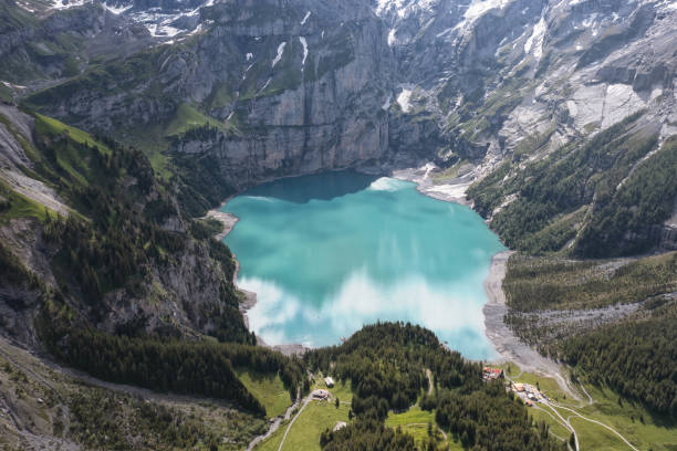 istock Blue lagoon in high mountain from aerial view 1362575109