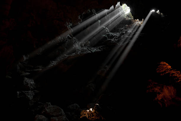 sun rays in the cave sun rays shining  the cave ingleborough stock pictures, royalty-free photos & images