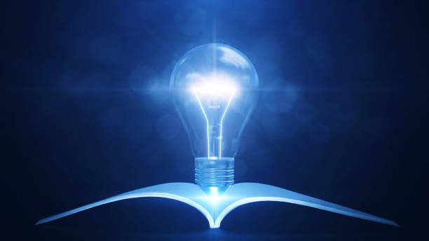 istock Knowledge gained from reading books or textbooks can help create new innovative ideas. There was a book under the glowing light bulb. against a dark blue background. 1362576626