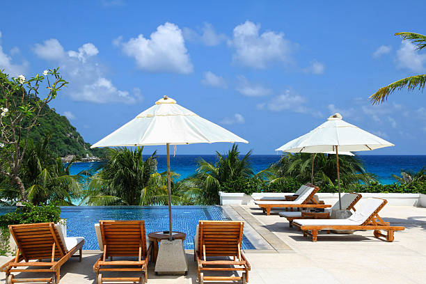 istock Sunbathing Beds along the swimming pool 136257846