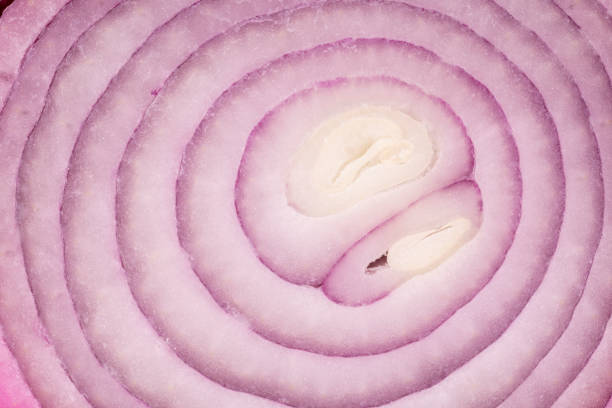 istock A background of sliced red onion, close up 1362579573