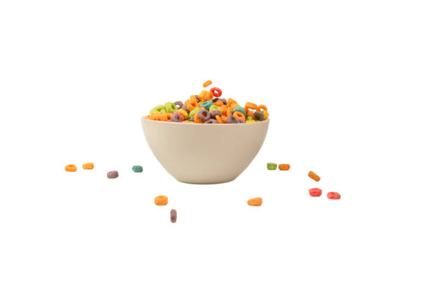 Colorful cereal box for morning breakfast. Corn flakes falling to the white bowl. Motion.