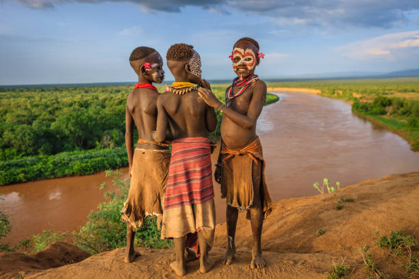 Young boys from Karo tribe, Ethiopia, Africa The Karo tribe is a tribe that lives in the southwestern region of the Omo Valley near Kenya, Africa. They are largely pastoralists. omo river photos stock pictures, royalty-free photos & images