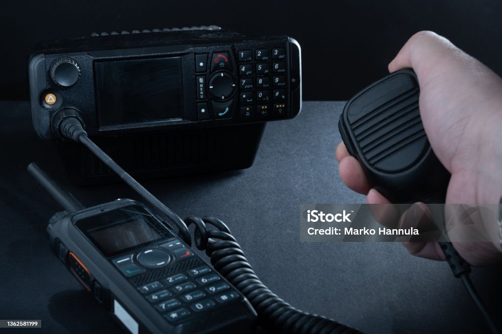 Closeup of pair of mobile two-way radios for Amateur radio operators against dark background. Helsinki / Finland - JANUARY 3, 2022: Closeup of pair of mobile two-way radios for Amateur radio operators against dark background. CB Radio Stock Photo Closeup of pair of mobile two-way radios for Amateur radio operators against dark background. Helsinki / Finland - JANUARY 3, 2022: Closeup of pair of mobile two-way radios for Amateur radio operators against dark background. CB Radio Stock Photo
